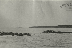 The Breakwater breached by a gale in 1957 on the 21st of June. The new construction then had on protecting outer slope ,the twelve feet high wall took the full force of the heavy seas. the bed of the breakwater was consolidated by this storm.  Photo from the Peter Burch Collection.